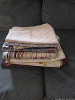 Stack of assorted pillowcases showing varied patterns and colours