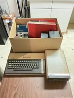 Atari 800XL, 1050 disk drive, accessories box overview