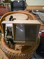 Front and side view of Baia Brite-View Dual 8 viewer showing screen, film reel arm and housing
