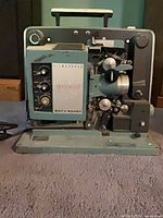 Front view of Bell & Howell Filmsound Specialist projector showing control panel and film mechanism