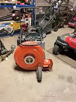 Full view of Billy Goat Quiet Blow blower showing housing, wheels and handle