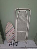 Full view of all three items: folded full-size ironing board, sleeve board, Black & Decker iron