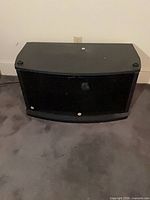 Front view of TV stand, doors closed