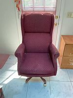 Front view of burgundy wingback office chair