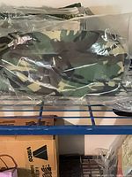 Camouflage fabric canopy sealed in plastic