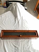Box closed showing cherry wood frame and glass top