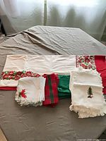 Tablecloth folded with assorted napkin stacks