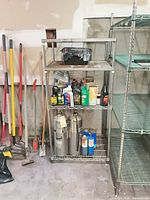 Full view of shelving unit with contents for scale