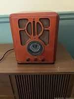 Front view of Crosley CR72CD showing speaker grille and tuning dial