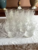 Group shot of all 20 crystal glasses arranged on table