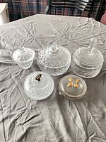 All five covered dishes grouped on table