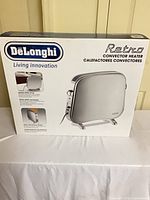 Front of unopened DeLonghi Retro convector heater box