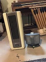Dynasty evaporative cooler standing next to Patton space heater