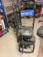 Front view showing EX-CELL 2100 PSI label, frame, engine, hose and wand