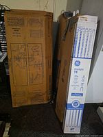 GE Daylight T8 bulb case and two larger fixture boxes