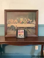 Large Last Supper print and small Walking on Water print displayed together
