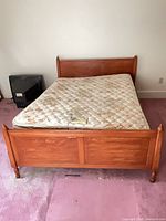Full view of bed frame with mattress in place