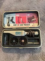 Open case showing polisher, brushes, pad