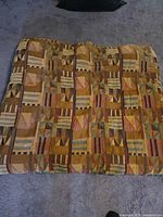 Full view of queen comforter laid flat showing overall geometric pattern