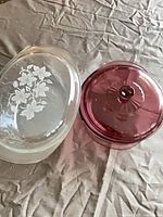 Clear oval casserole and purple round casserole side by side