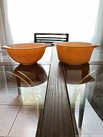 Side view of both glass mixing bowls on table