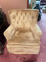 Front view of gold/beige velvet wingback chair