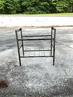 Front view of gray two-tier metal rack