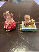 Both ornaments side by side on table