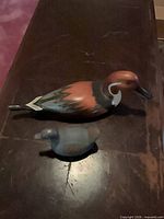Both duck pieces side by side for scale and color reference