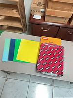 Group view showing packs of hanging folders and colored pocket portfolios