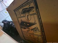Large cardboard box showing graphics of Harvard table tennis table