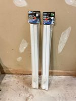 Both packaged HomeScape closet rods standing upright