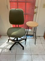 Front view of HON drafting chair and wood-top stool