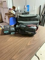 Camcorder with carrying bag and two VHS-C tapes