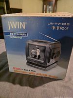 Retail box front showing JV-TV1010 image and specs