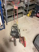Full view of King O' Lawn gas edger showing handle, engine, wheels, blade guard