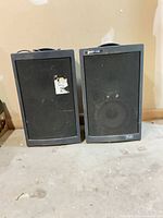 Front view of both Liberty 4500 speakers showing grilles and overall wear