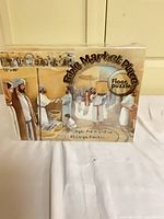 Front view of sealed LifeWay Press Bible Market Place floor puzzle box