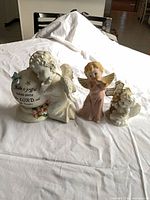 Group view of all three angel figurines