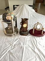 All three desk clocks side by side on table