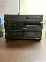 Stacked view of all three VCRs showing fronts and brand markings