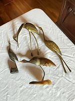 All four bird figurines laid out for overview