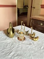 Group shot of all five bird figurines