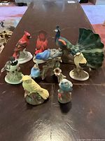 Group shot showing all nine bird figurines