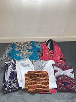 All seven garments laid out together