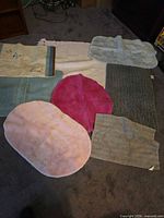 Group shot displaying all nine bath mats with varied colors, materials and shapes