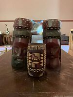 Group shot of two busts and painted cup