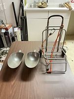 Hand truck and two scoops on tabletop