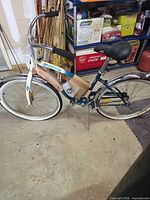 Full left side view showing frame, wheels, fenders, kickstand, protective wrap