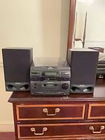 Full stereo system with main unit and two speakers